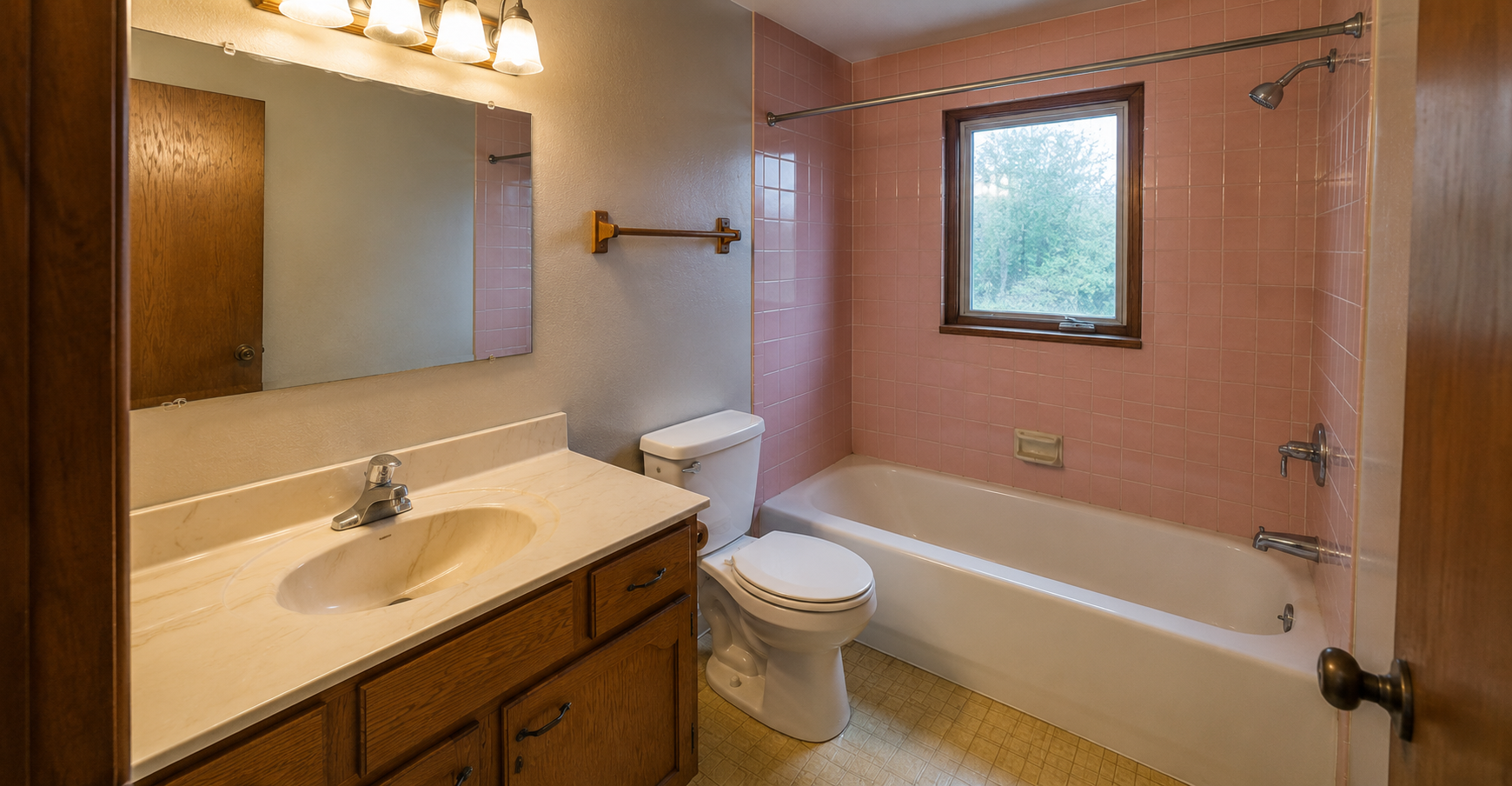Bathroom before renovation in Dubai — outdated tub and tiles